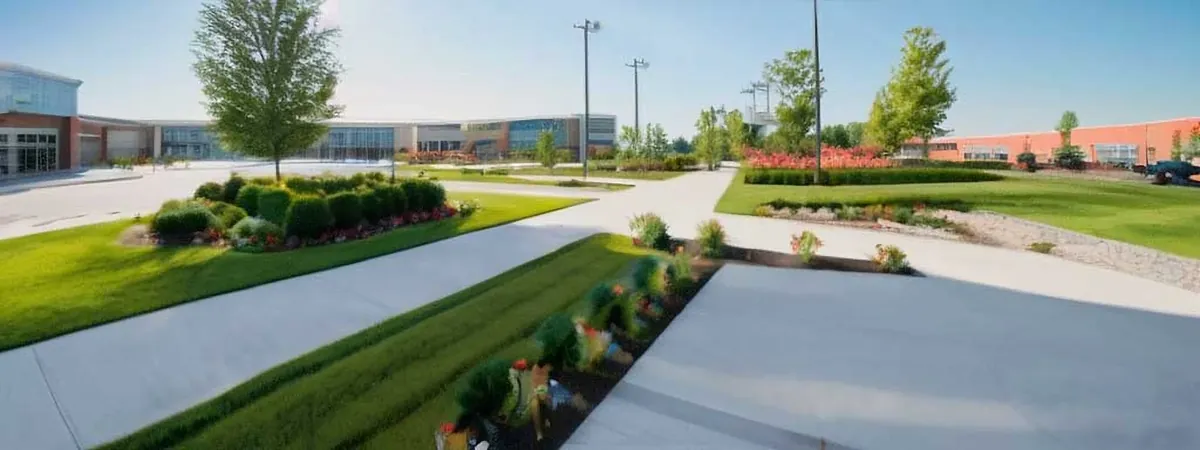 Business park walkways bordered by lawn and planted islands