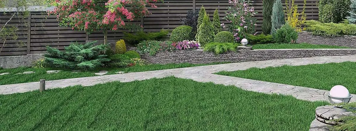 Office campus with lawn and red seasonal flower beds